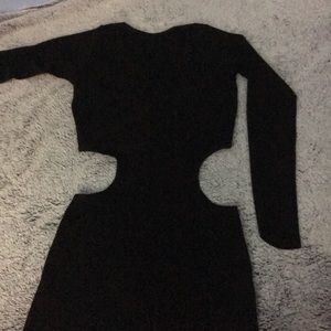 Sexy form fitting black dress with sides cut out!